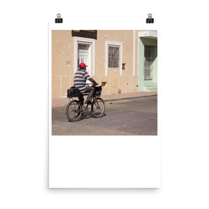 Wall art color photography print poster of a man riding a bicycle on the streets of Valladolid Mexico